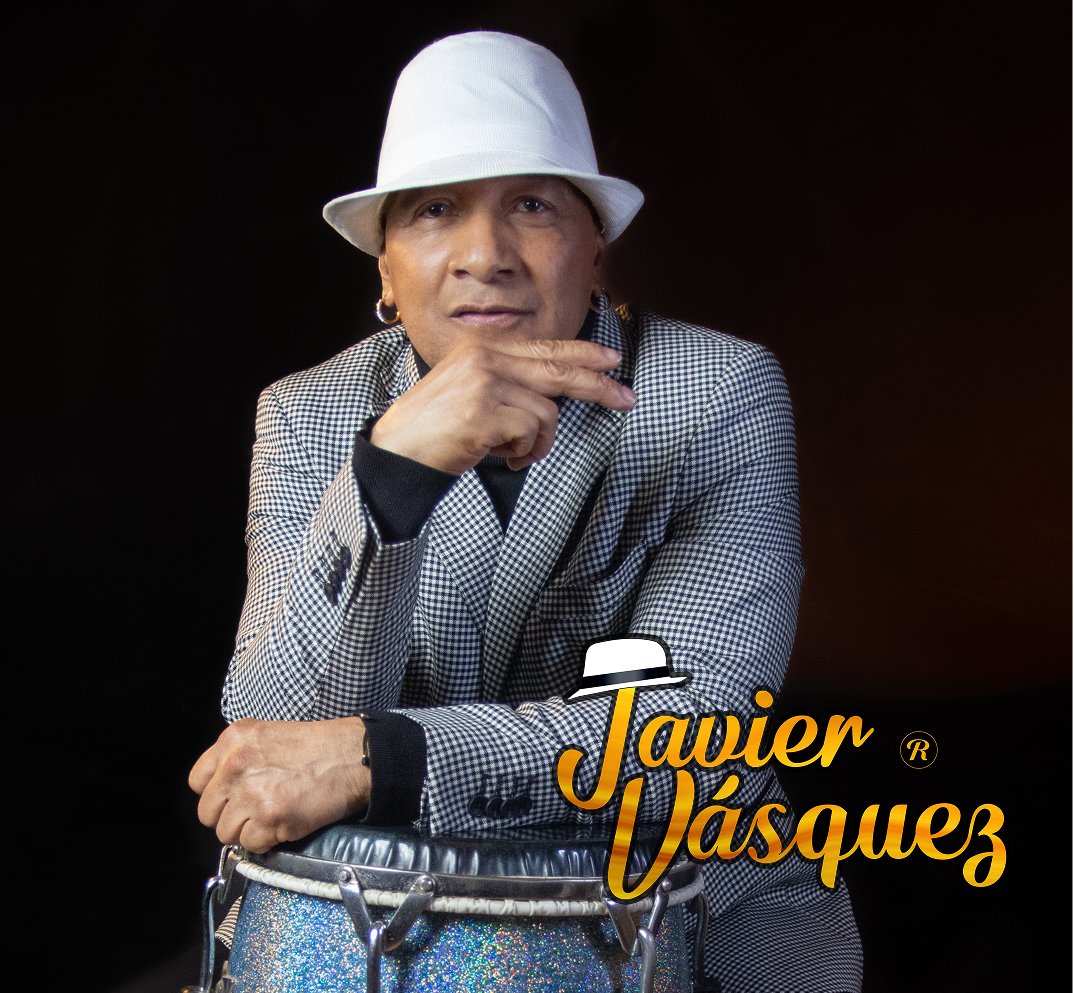 JAVIER Man in hat with conga drum.