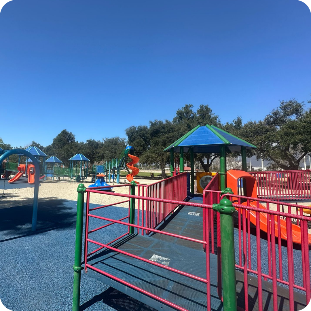 kid zone Colorful playground with slides and climbing structures.